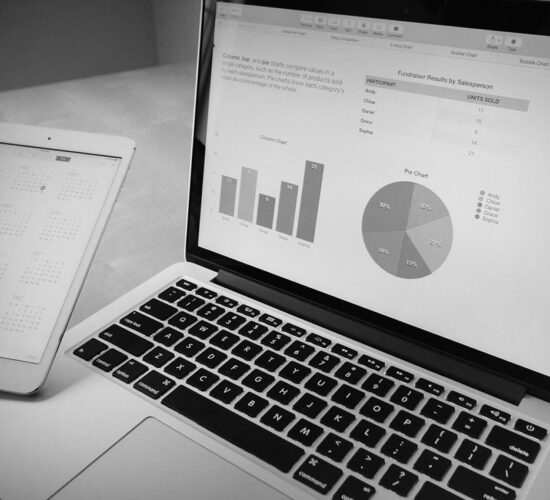 A laptop with a pie chart to represent Business Studies at East Barnet School