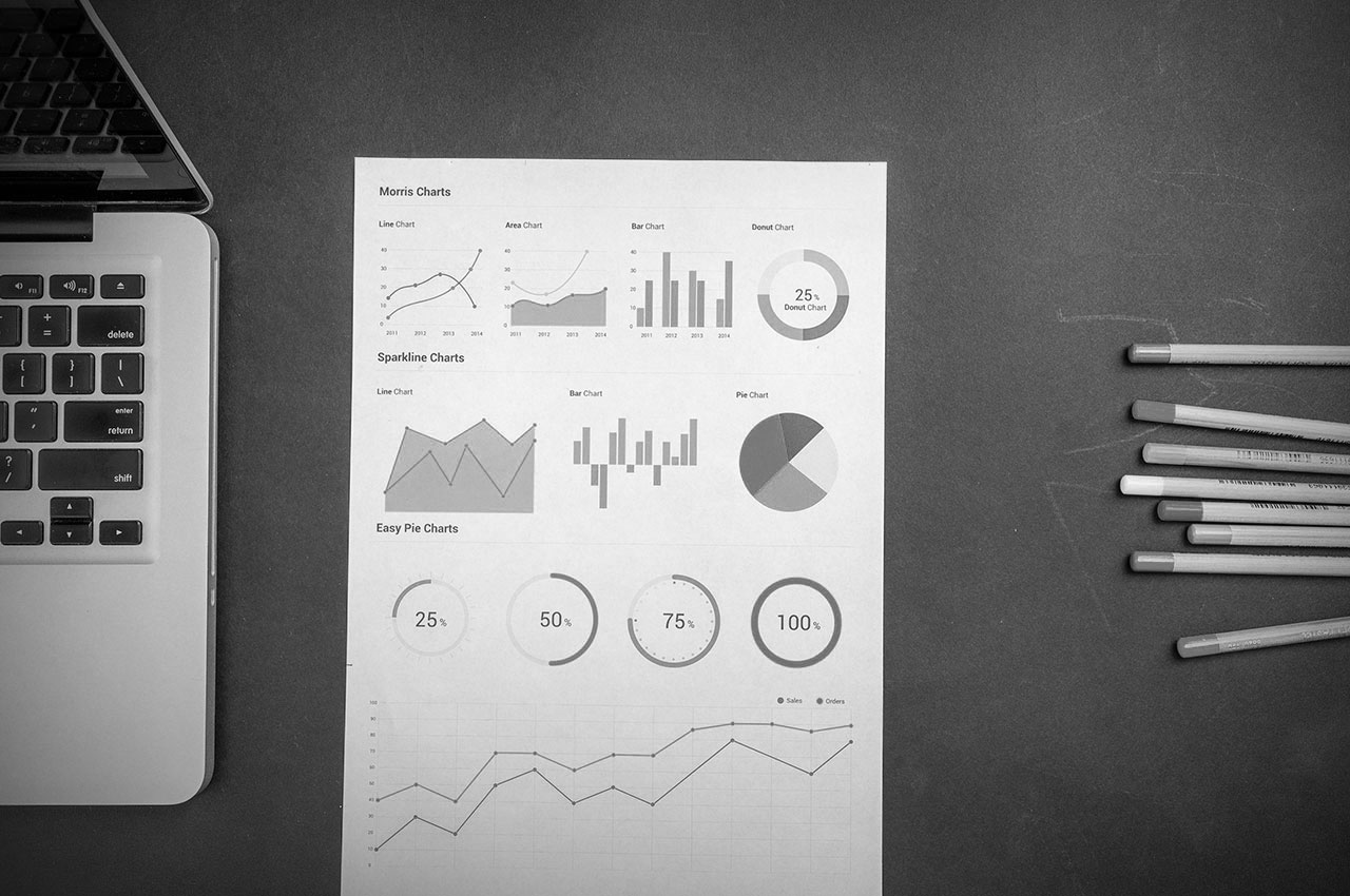 A laptop and chart that is used for the Cambridge Technical Business Studies Diploma at EBS