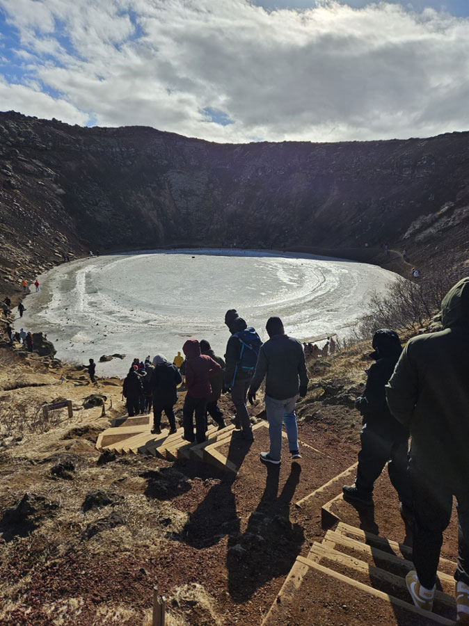 EBS students walking down a volcano crater in Iceland